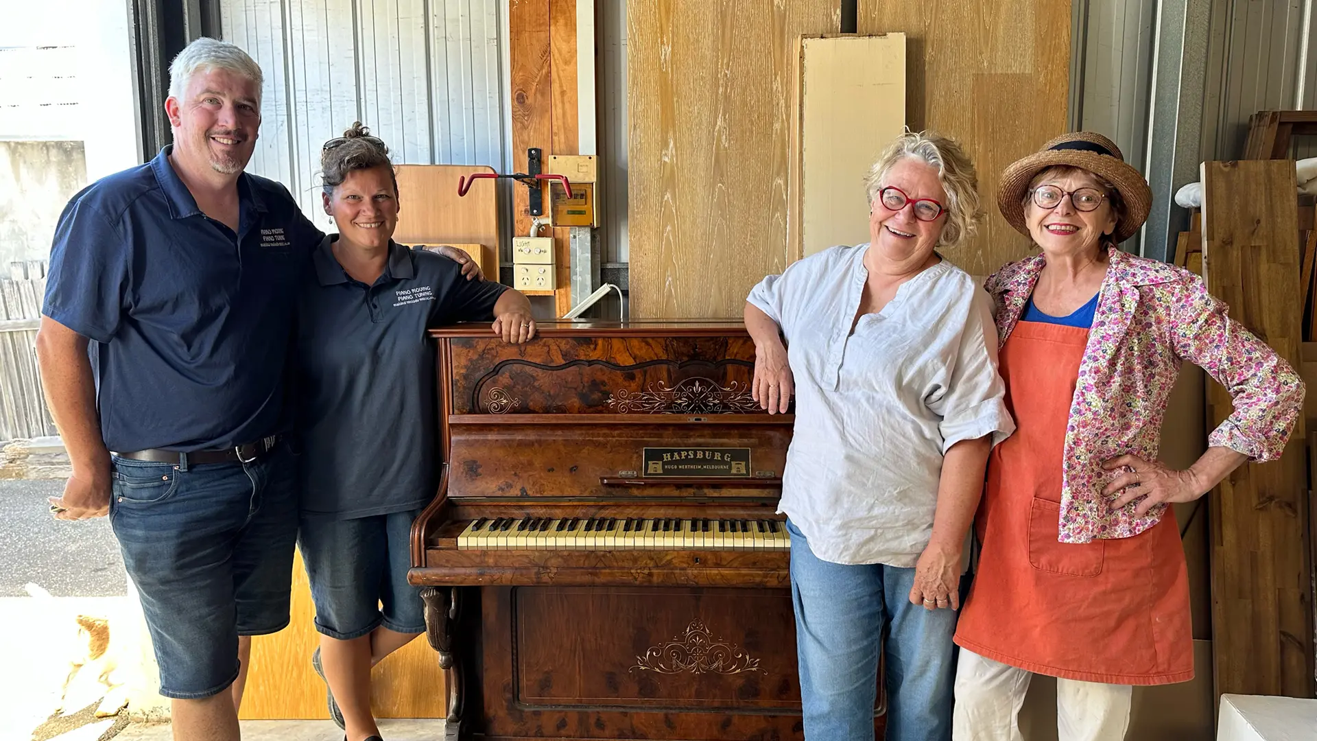 Helen Sandercoe and Eliza Tree from Maine Guerilla Pianos shifting a donated piano from Fryerstown with Joshua McPherson and Sandra from Making Melody Music.