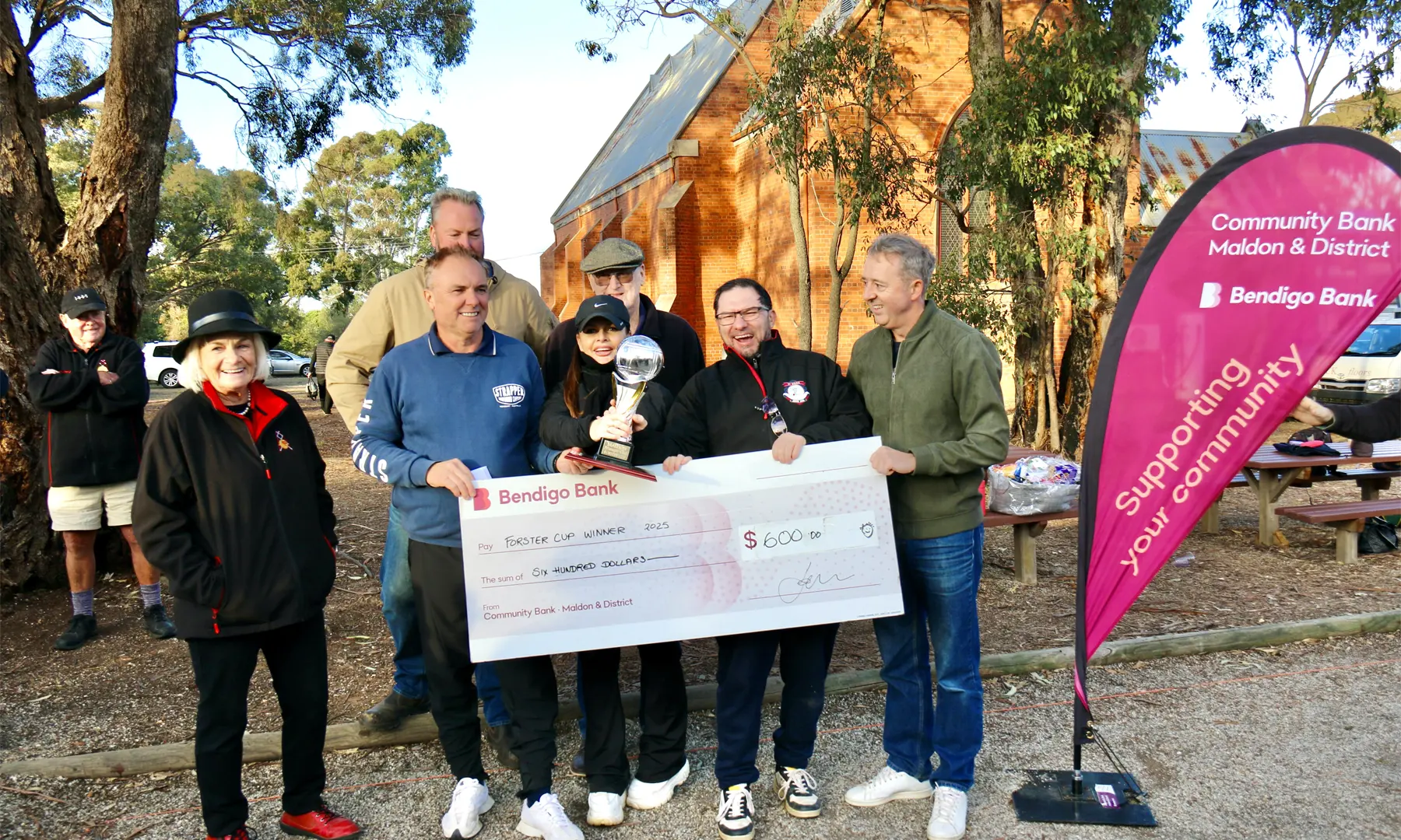 …and we have the winners! Stephane and Muriel Langlois with Chris Serre, flanked by umpire Beverley Forsyth and bank board member Michael Annear.